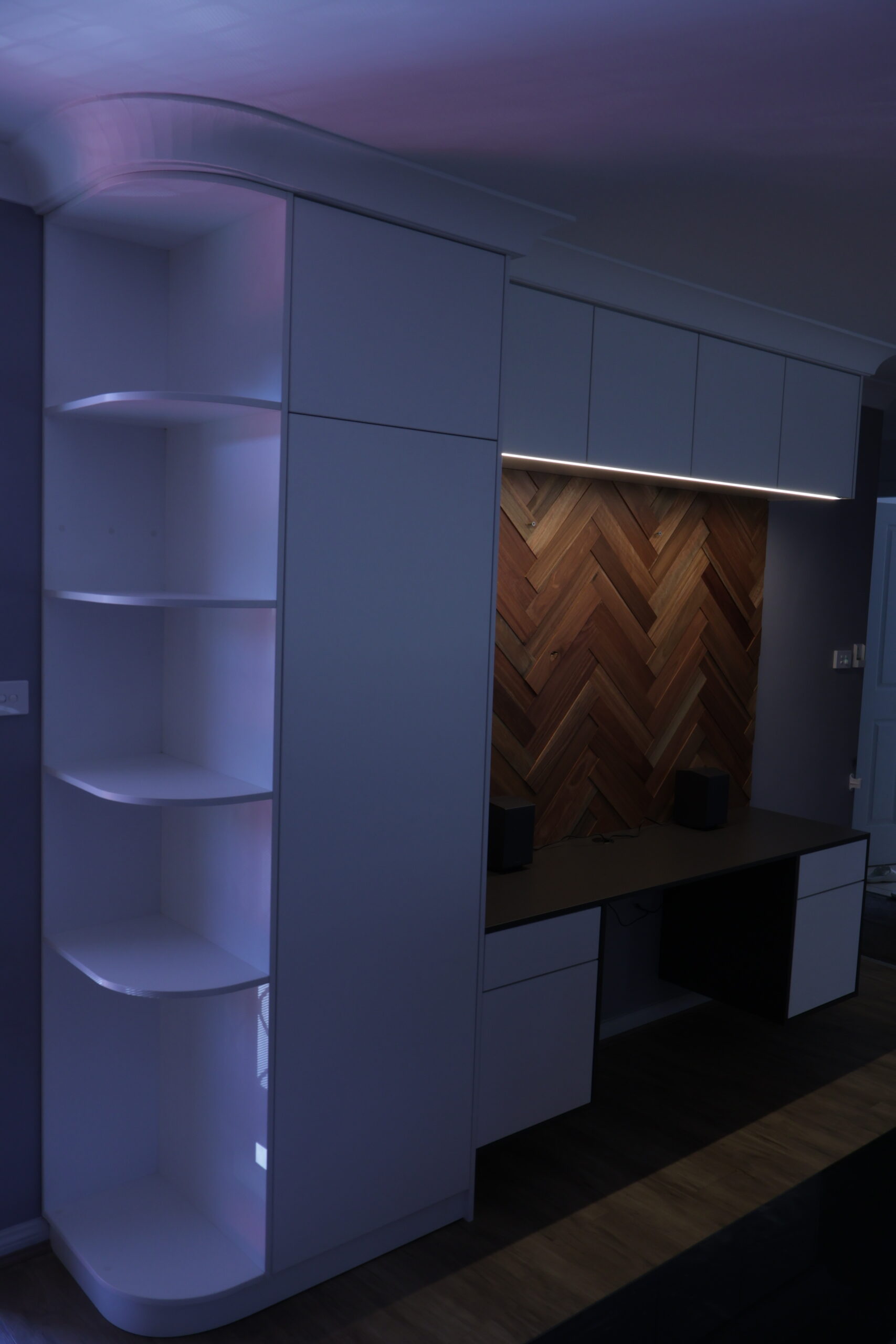 Custom spotted gum herringbone feature wall with entry cabinet and architectural detailing in Wollongong NSW
