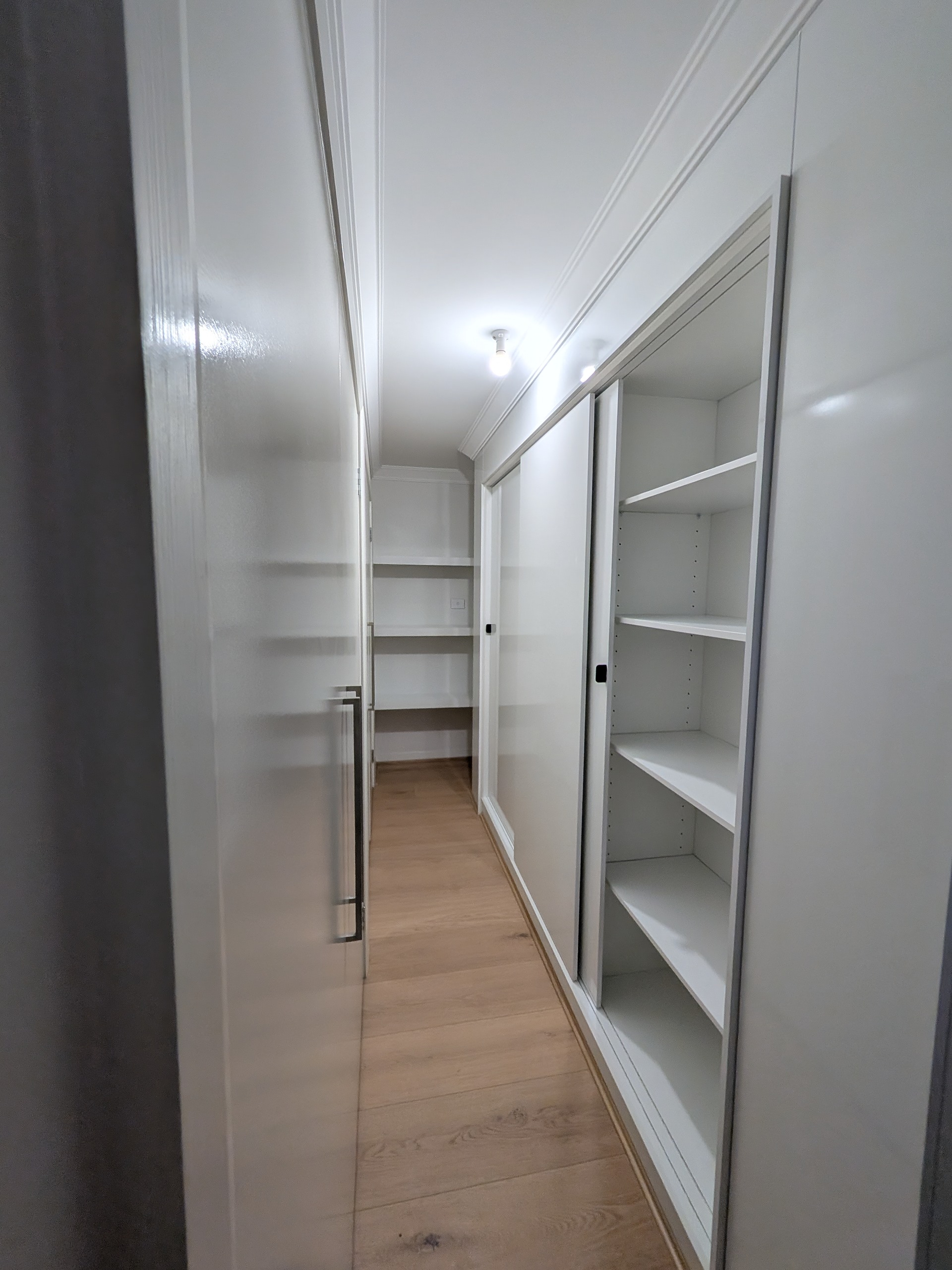 Walk-in wardrobe shelving and sliding door cabinetry installation in Wollongong NSW