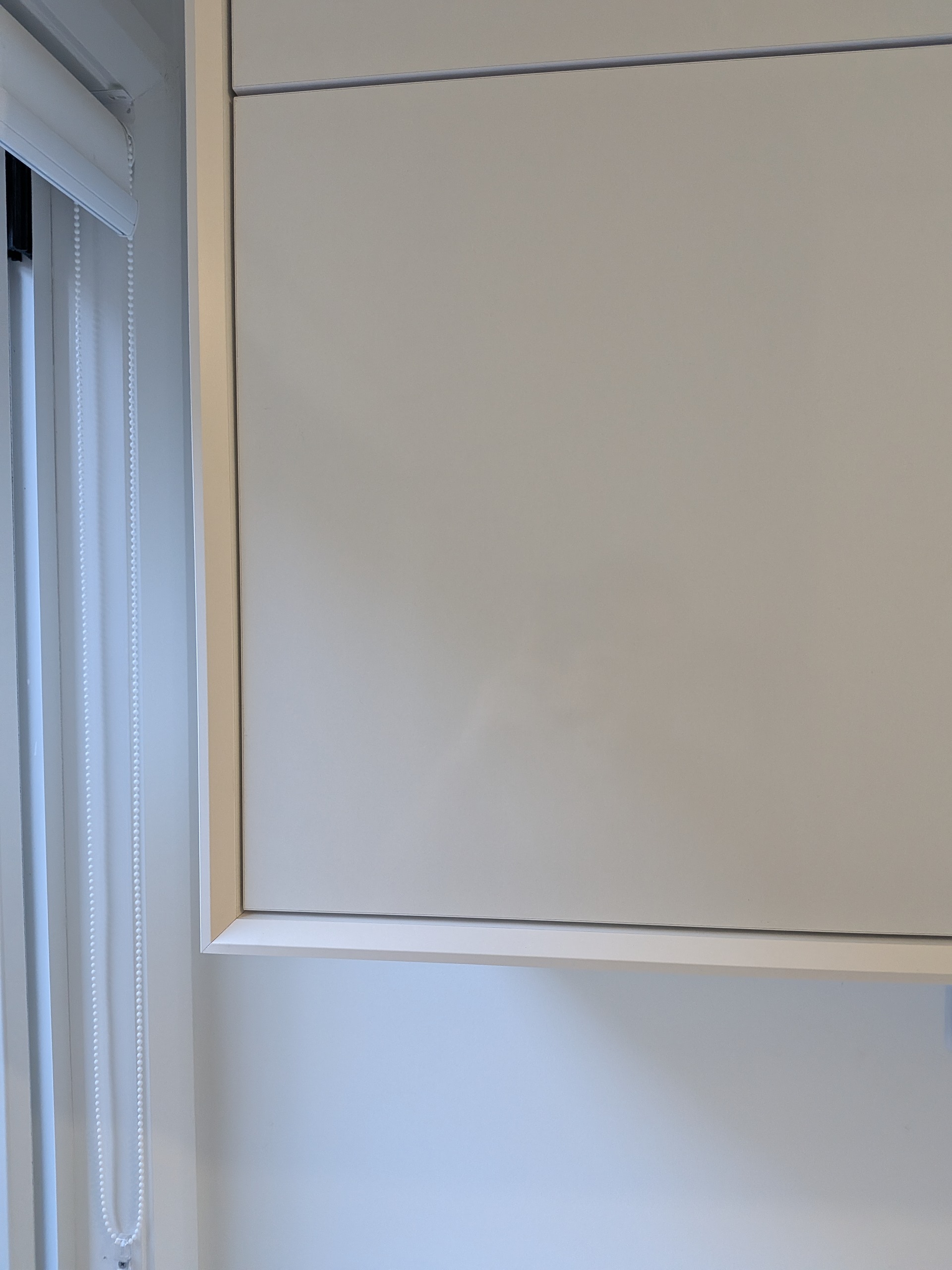 Custom shaker-profile cabinetry with shark nose detailing and premium craftsmanship in Shellharbour NSW.