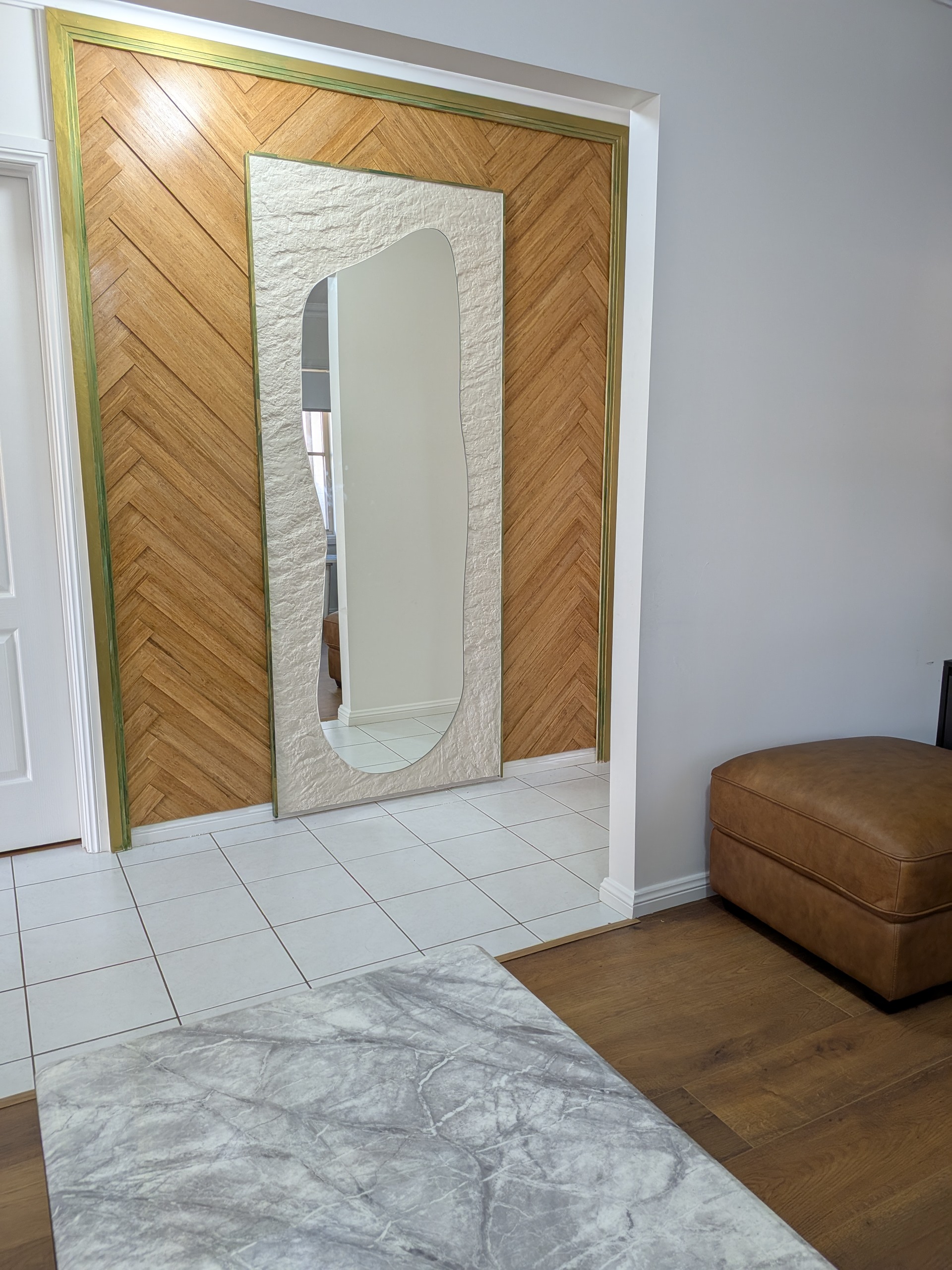 Custom bamboo herringbone feature wall with irregular mirror design in Wollongong NSW