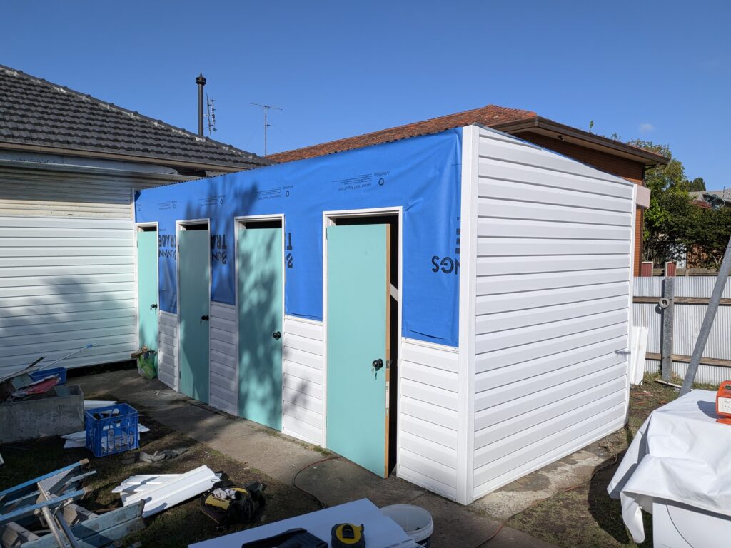Exterior wall renovation with insulated vinyl cladding for improved year-round comfort