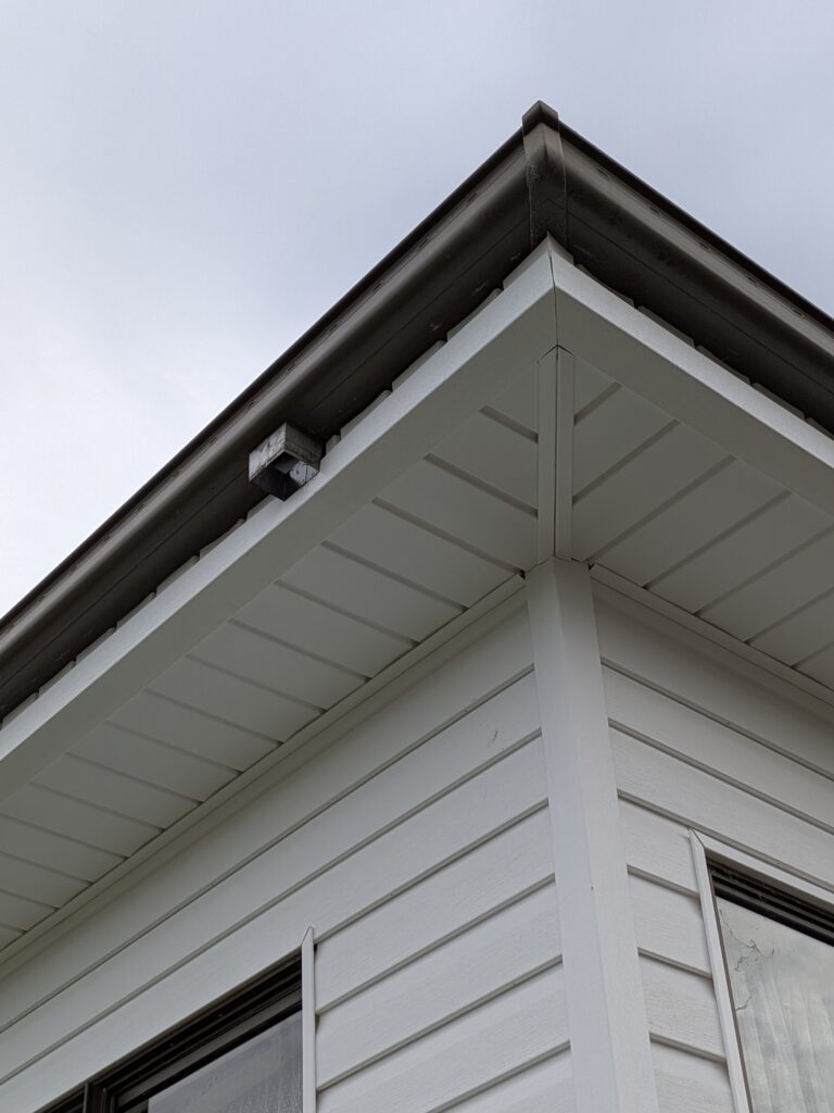 Residential house recladding in Wollongong using white solid vinyl wall cladding